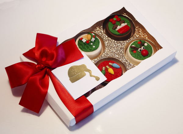 Image of ugly christmas sweater chocolate covered oreos in a white gift box with a red satin bow as a fun cookie delivery gift from Benedict Treats
