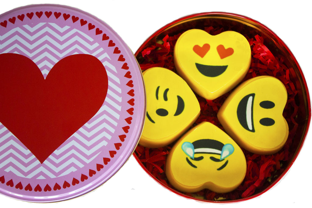 Image of 4 vibrant yellow heart emoji oreos® in a round gift tin for mail delivery from Benedict Treats