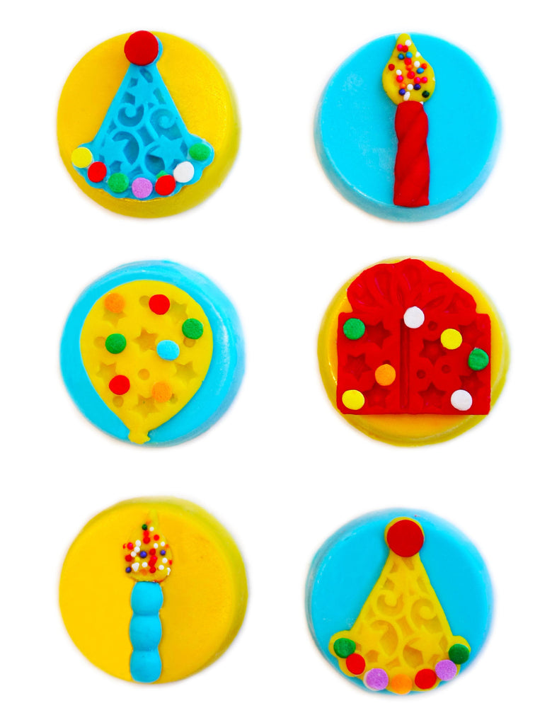Image of candy coated oreos® with fun designs on top as a birthday gift from Benedict Treats