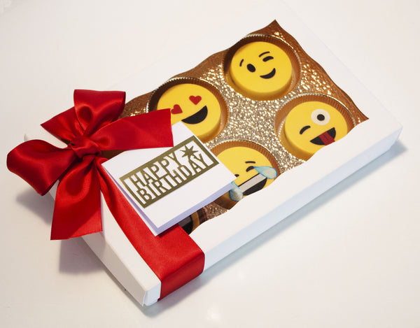 Image of emoji oreos in a nice white gift box with a red satin bow as a cookie delivery gift for a birthday or any occasion from Benedict Treats
