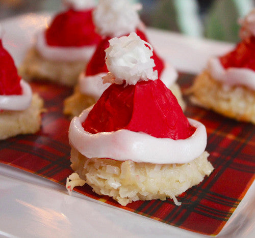 Image of coconut macaroons decorated to look like Santa Hats from Benedict Treats